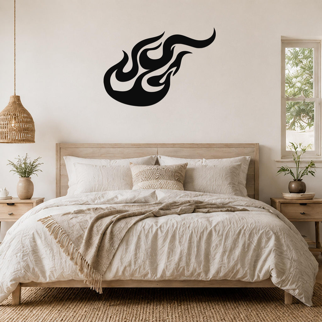 Black metal flame wall art with flowing silhouette design, mounted above a wooden bed in a neutral bedroom.