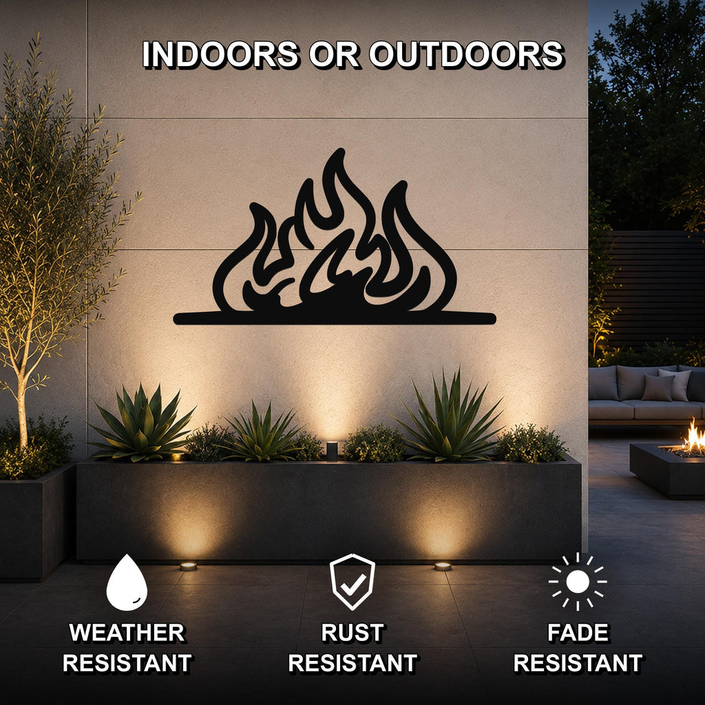 Black metal flame silhouette wall art mounted on an outdoor wall above a planter, with text indicating it is weather, rust, and fade resistant for indoor or outdoor use.