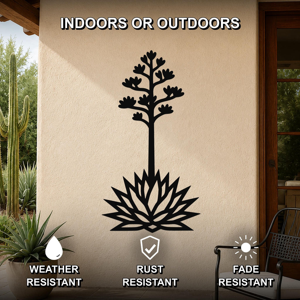 Black metal agave wall art with blooming flower and spiky leaf cutouts, mounted on an outdoor patio wall.