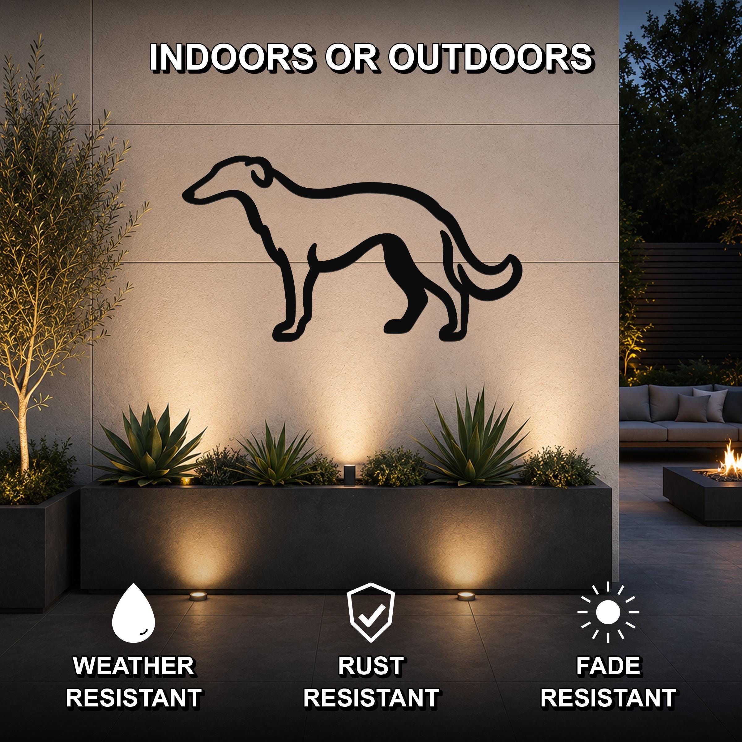 Black metal Borzoi dog silhouette wall art mounted on an outdoor wall above a planter, with text indicating it is weather, rust, and fade resistant.