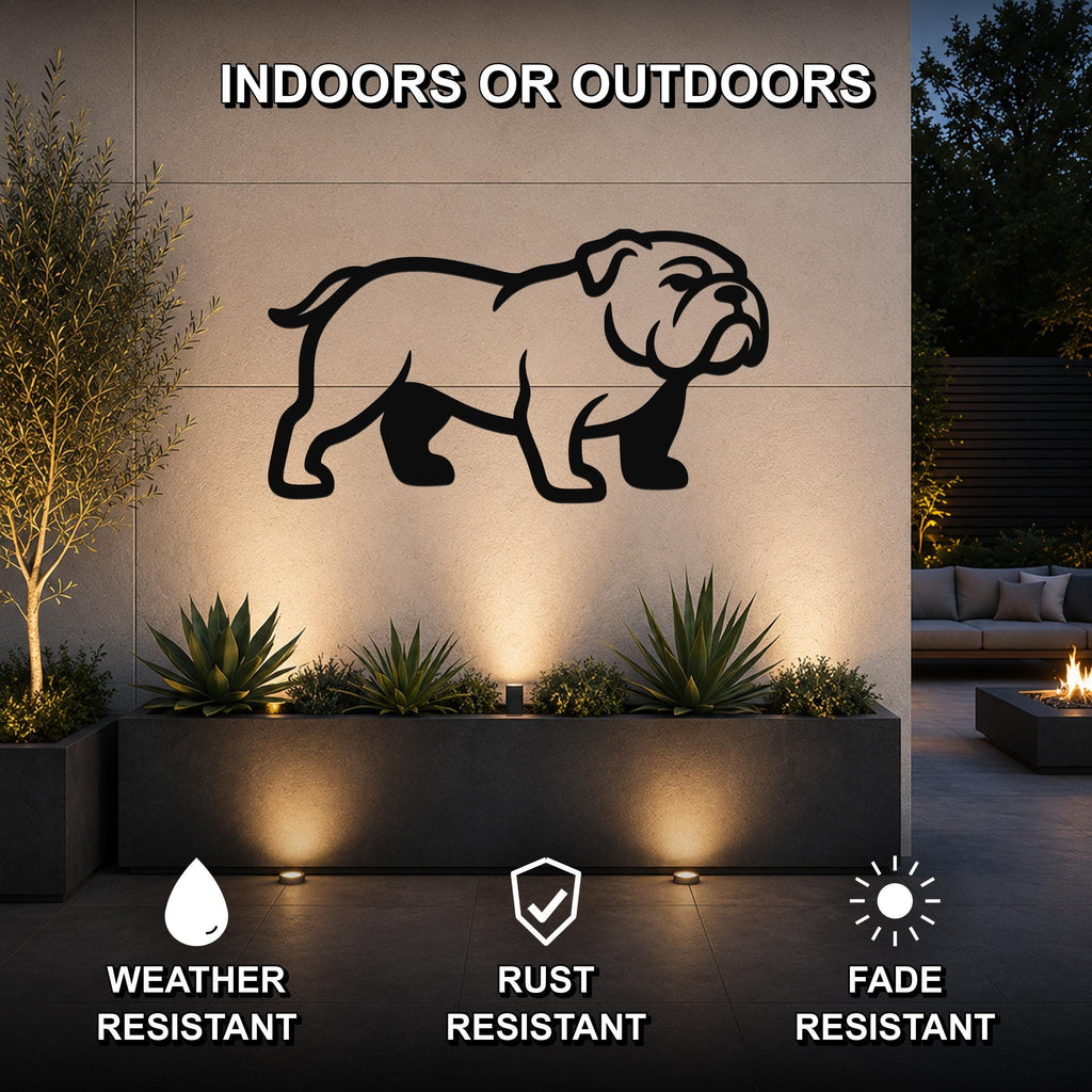 Black metal bulldog silhouette wall art mounted on an outdoor wall above a planter, with text indicating it is weather, rust, and fade resistant for indoor or outdoor use.