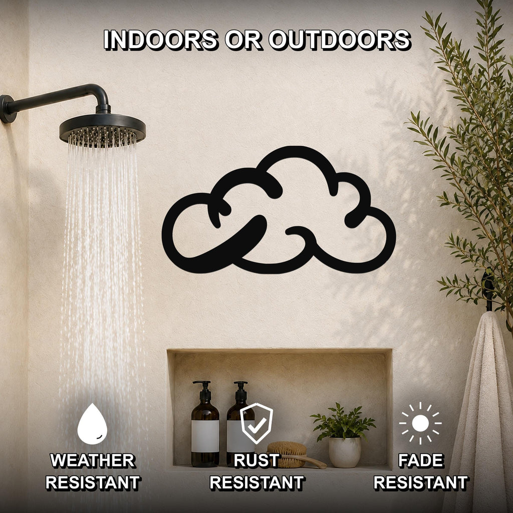 Black metal cloud wall art with cutout design, mounted on a bathroom wall above a built-in shelf, shown under a running shower with text highlighting weather, rust, and fade resistance.