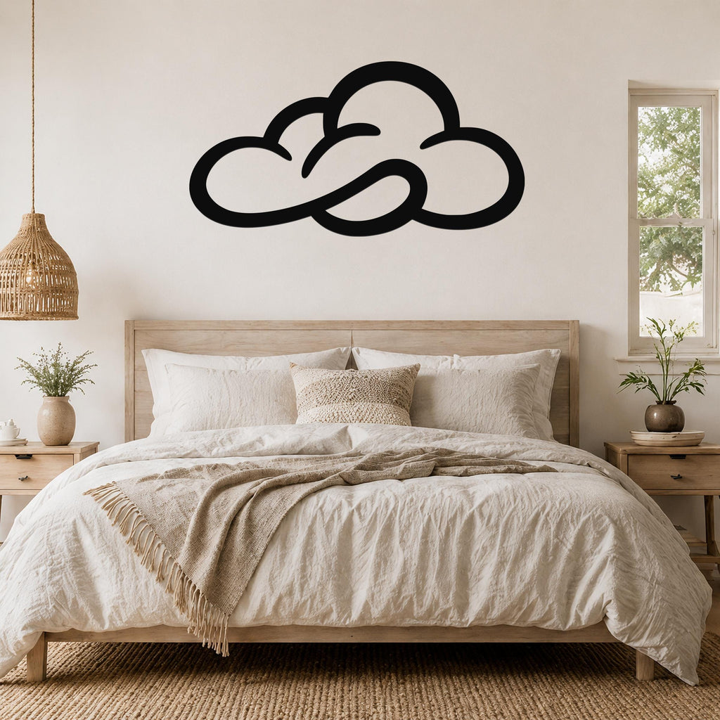Black metal cloud wall art with open silhouette design, mounted above a wooden bed in a neutral bedroom.