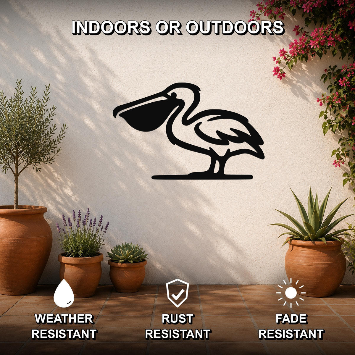 Black metal pelican wall art silhouette mounted on an outdoor patio wall, surrounded by potted plants and flowering vines.