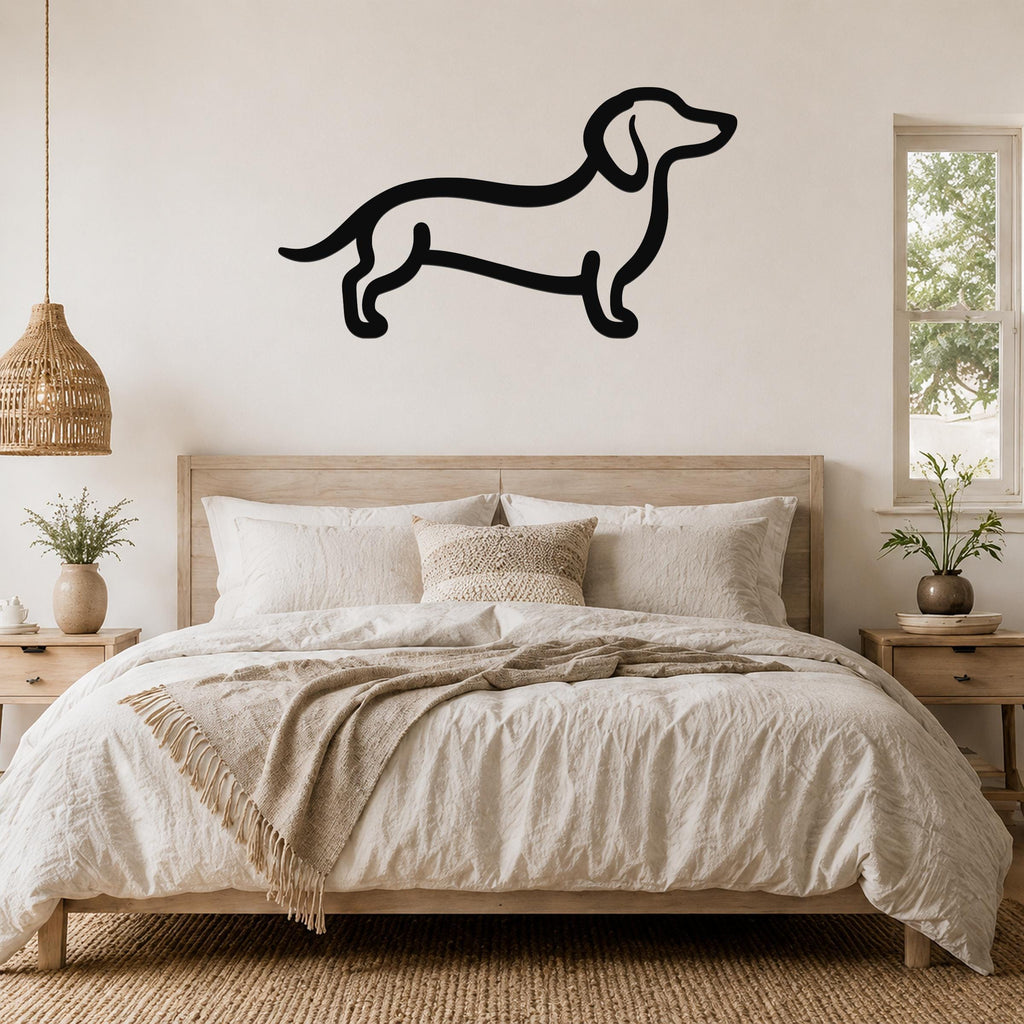 Black metal dachshund silhouette wall art mounted above a wooden bed in a neutral bedroom.