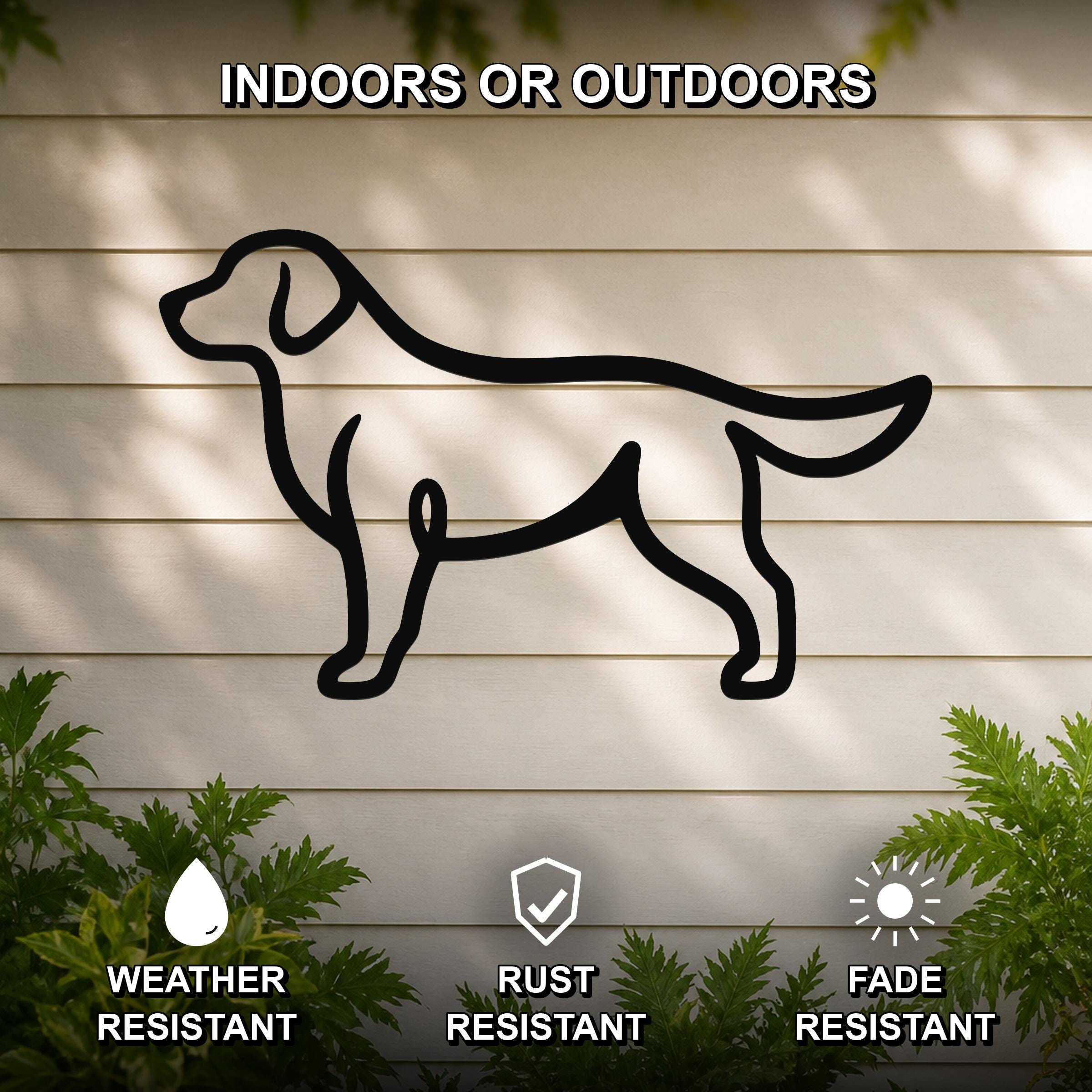 Black metal wall art featuring a bold silhouette of a dog, mounted on a light-colored outdoor wall with greenery, weather resistant, rust resistant, and fade resistant.