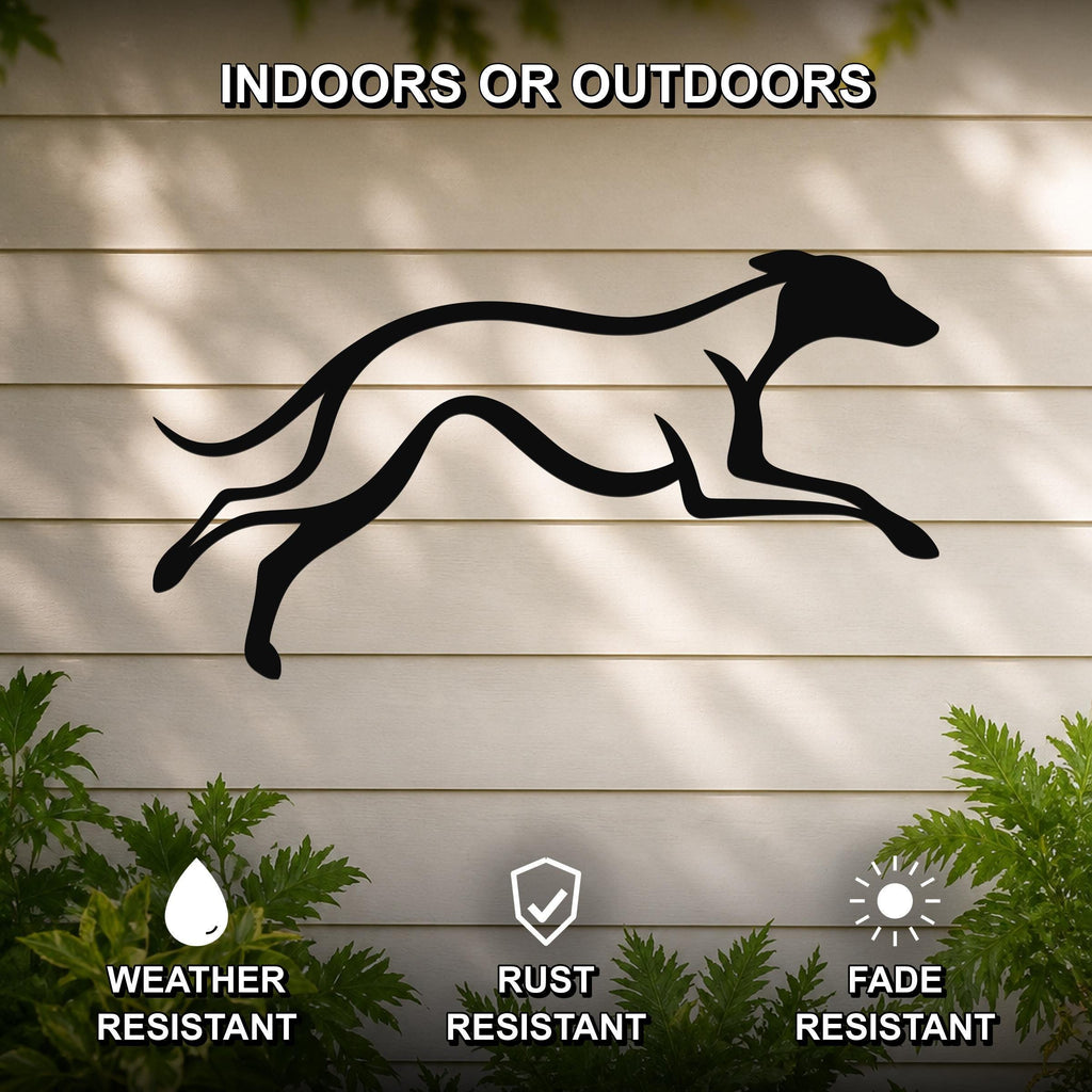 Black metal greyhound wall art silhouette with motion-line cutouts, mounted on a light-colored outdoor wall with greenery below.