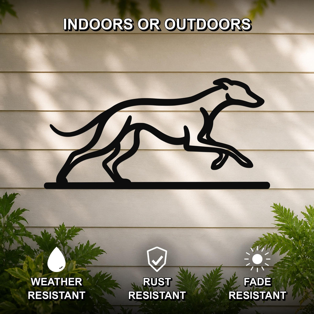 Black metal greyhound wall art silhouette with motion-line cutouts, mounted on a light-colored outdoor wall with greenery, weather resistant, rust resistant, and fade resistant.