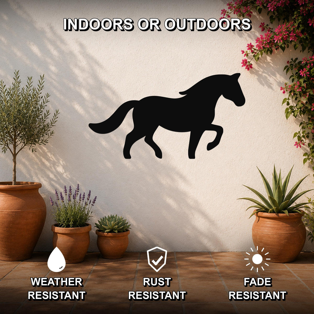 Black metal horse silhouette wall art mounted on a white outdoor wall, displayed above terracotta pots with plants on a tiled patio.