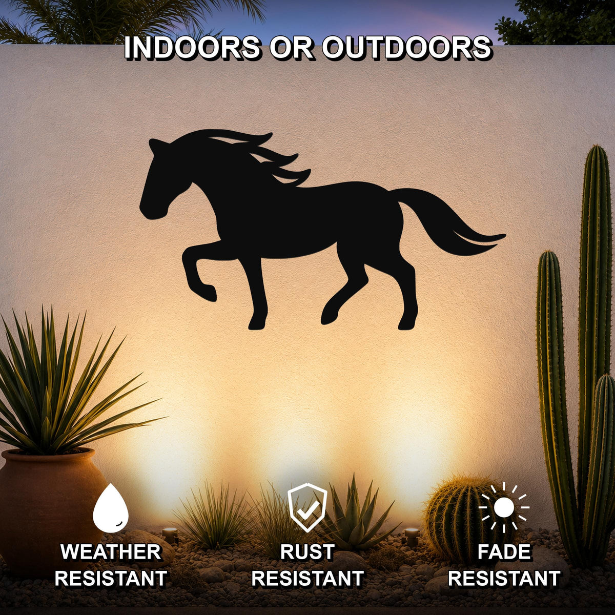 Black metal horse silhouette wall art mounted on an outdoor wall, displayed above a desert garden with cacti and potted plants.
