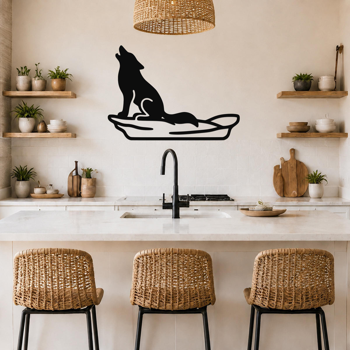 Black metal coyote wall art in a howling silhouette, mounted above a kitchen counter with a sink and wicker bar stools.