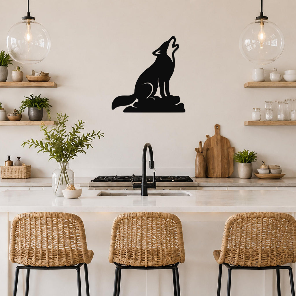 Black metal coyote wall art in a howling silhouette, mounted on a kitchen wall above a counter with wicker bar stools.