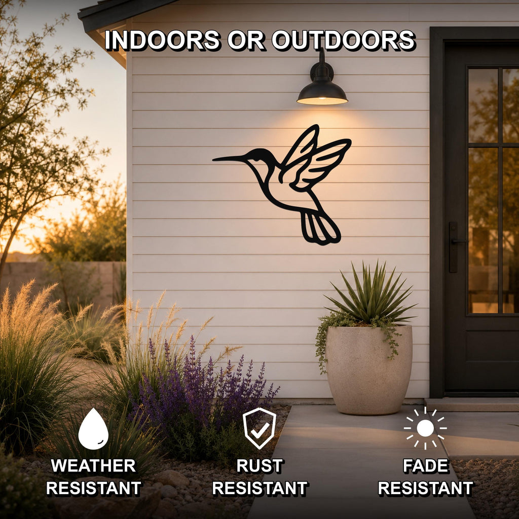 Black metal hummingbird wall art with motion-line cutouts, mounted on a white siding exterior wall above a patio, shown with weather, rust, and fade resistance icons.