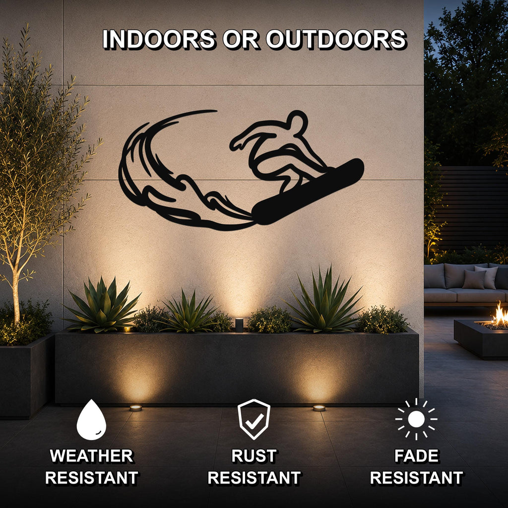 Black metal wall art silhouette of a snowboarder in motion, mounted on an outdoor wall above a planter with succulents, featuring weather, rust, and fade resistant properties.