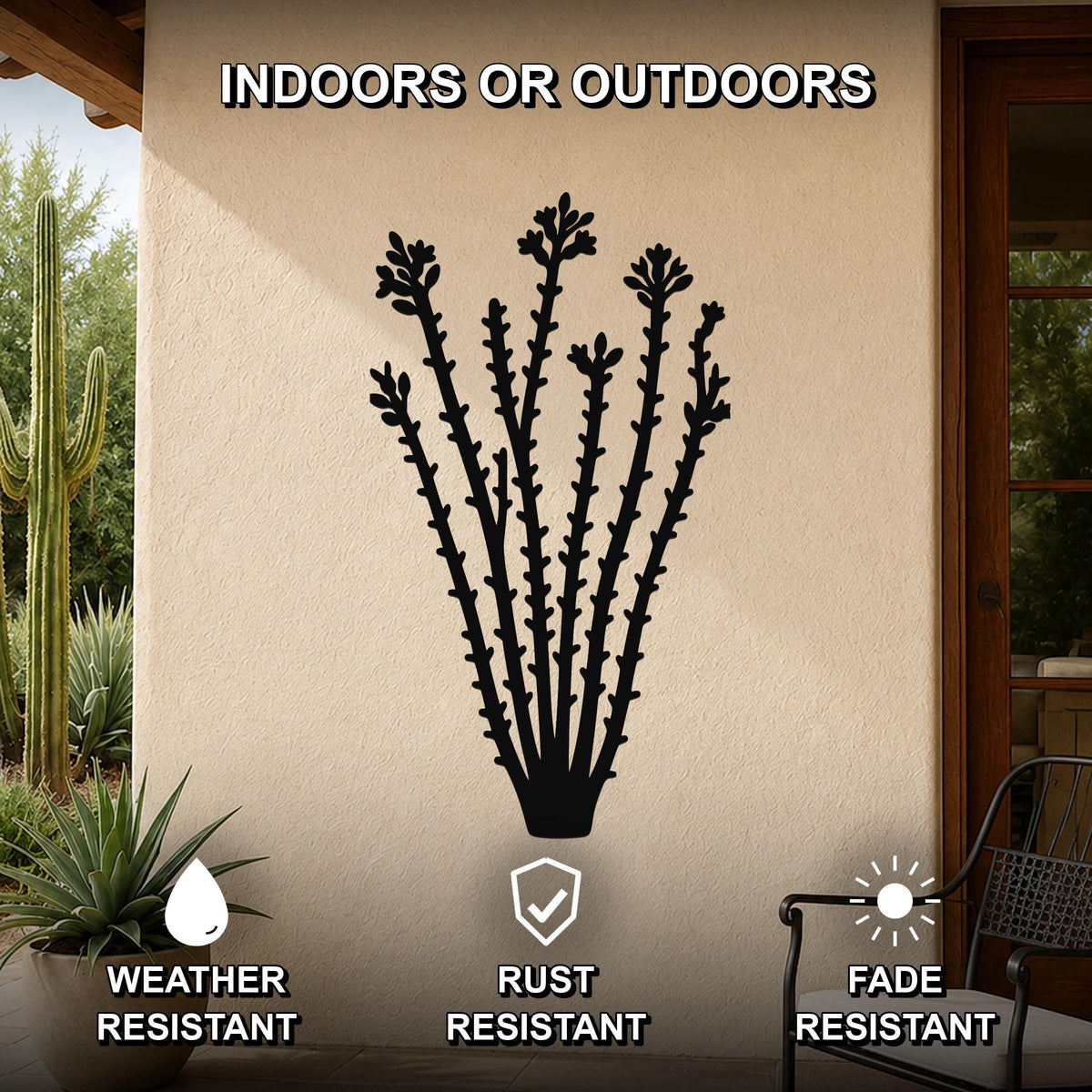 Black metal ocotillo wall art with detailed branch and flower cutouts, mounted on an outdoor patio wall above a potted plant.
