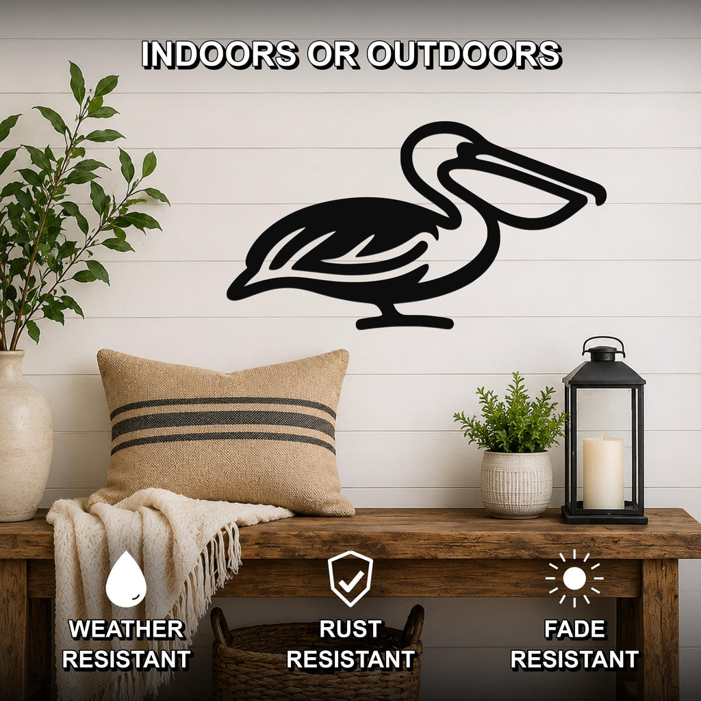 Black metal pelican wall art silhouette mounted on a white shiplap wall above a wooden bench in a living room.