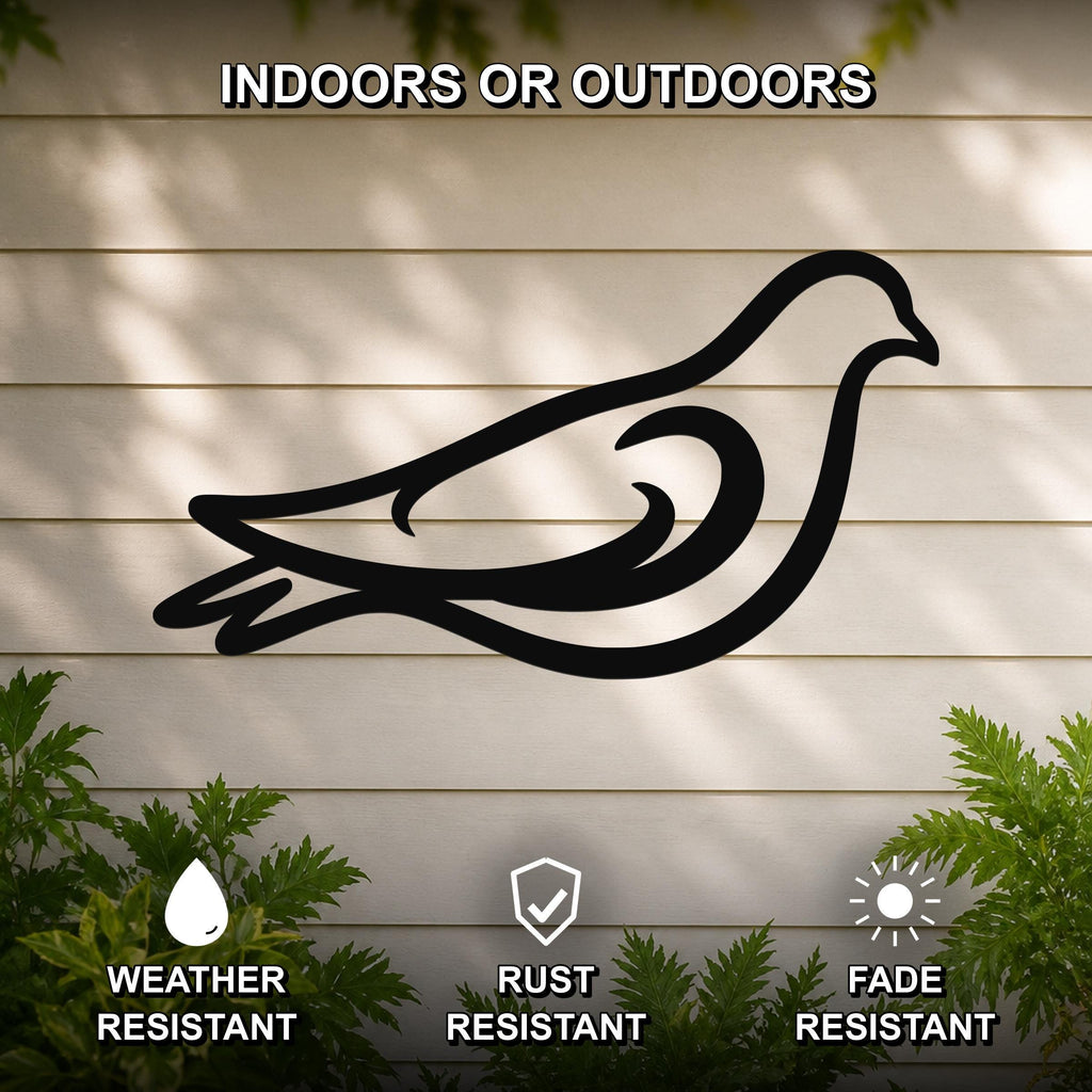 Black metal pigeon wall art silhouette with cutout details, mounted on a light-colored outdoor wall with greenery, weather resistant, rust resistant, and fade resistant.