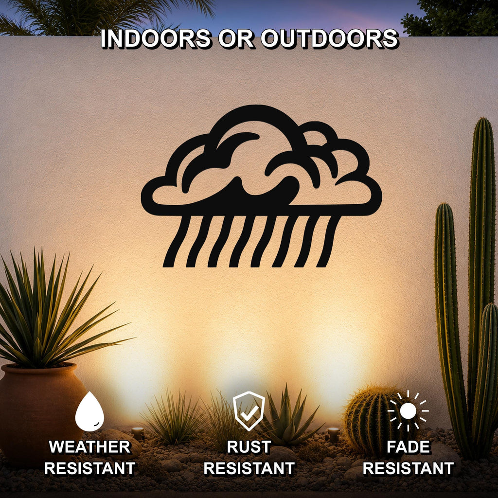 Black metal rain cloud wall art with raindrop cutouts, mounted on an outdoor wall above a desert garden with cacti and potted plants.