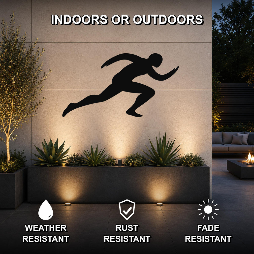 Black metal runner wall art with motion-line cutouts, mounted on an outdoor wall above a planter in a modern patio setting.