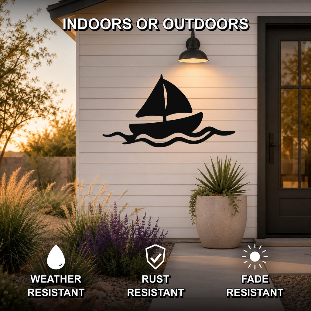 Black metal sailboat wall art with wave cutouts, mounted on a white siding exterior wall above a patio, shown with weather, rust, and fade resistance icons.