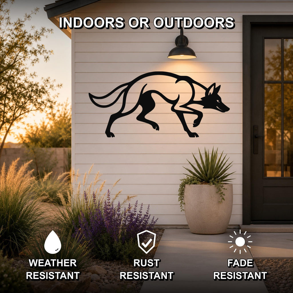 Black metal coyote wall art silhouette with motion-line cutouts, mounted on a white siding wall outside a home entrance.