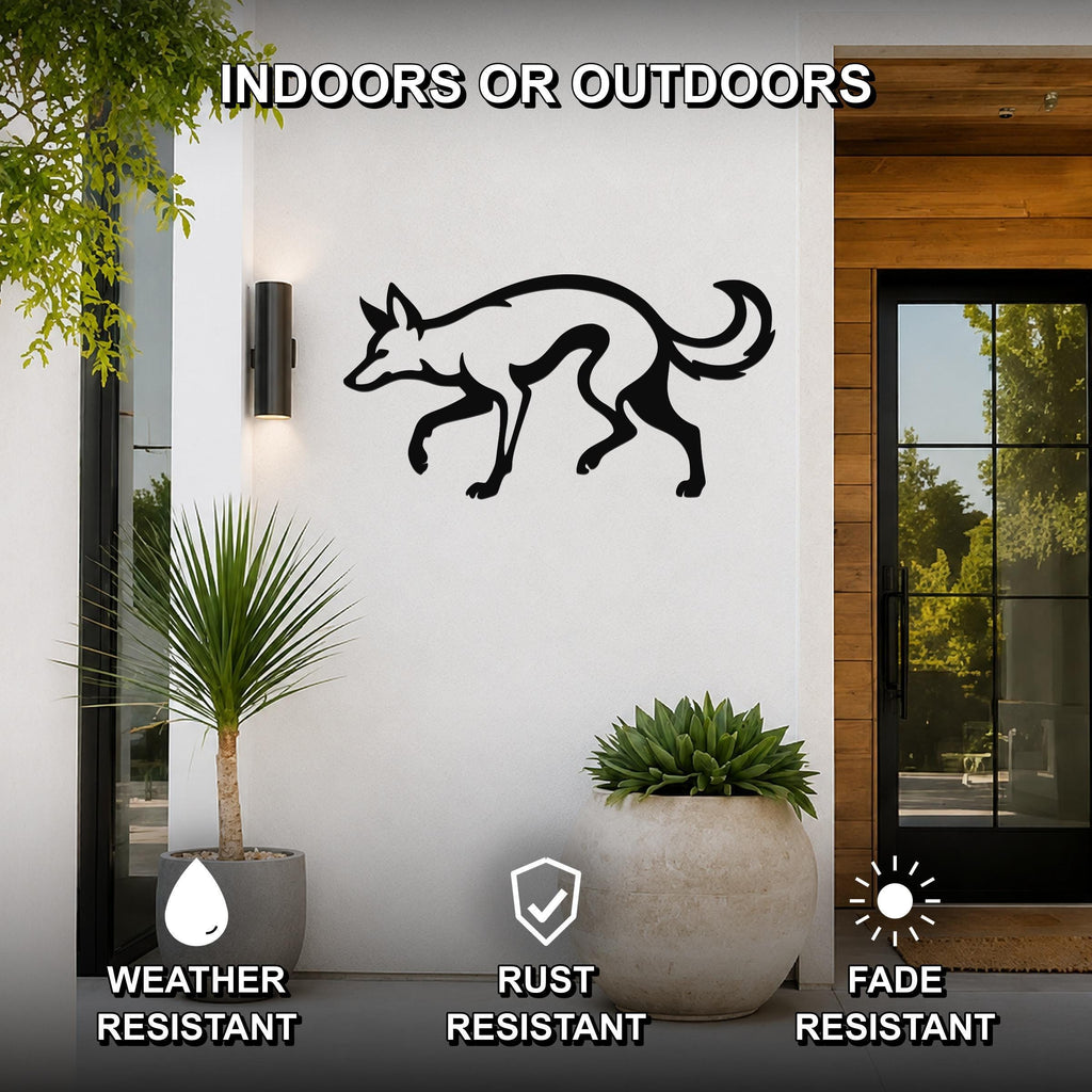 Black metal coyote wall art silhouette mounted on a white exterior wall beside a glass door and potted plants, with text indicating it is weather, rust, and fade resistant for indoor or outdoor use.