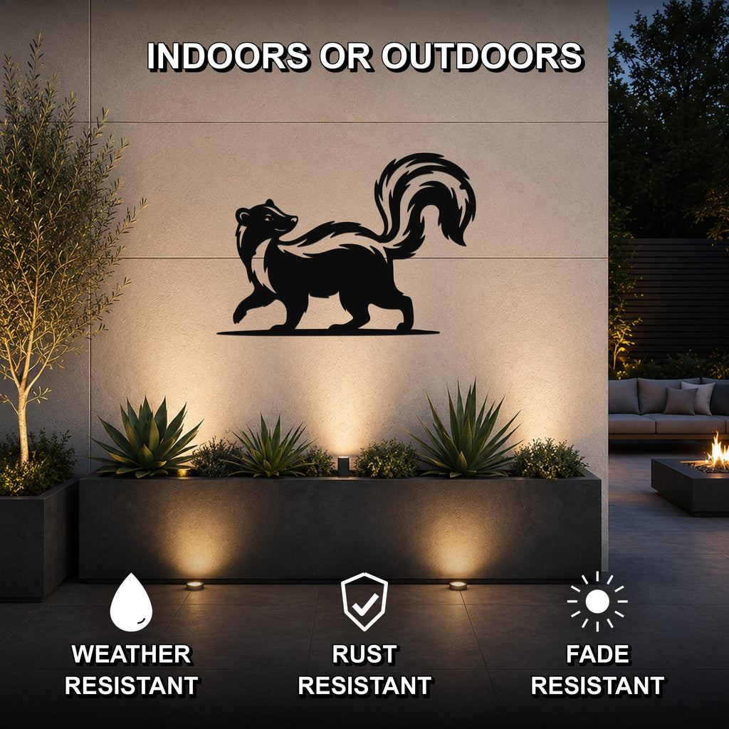 Black metal skunk silhouette wall art mounted on an outdoor wall above a planter, with text indicating indoor or outdoor use and features like weather, rust, and fade resistance.