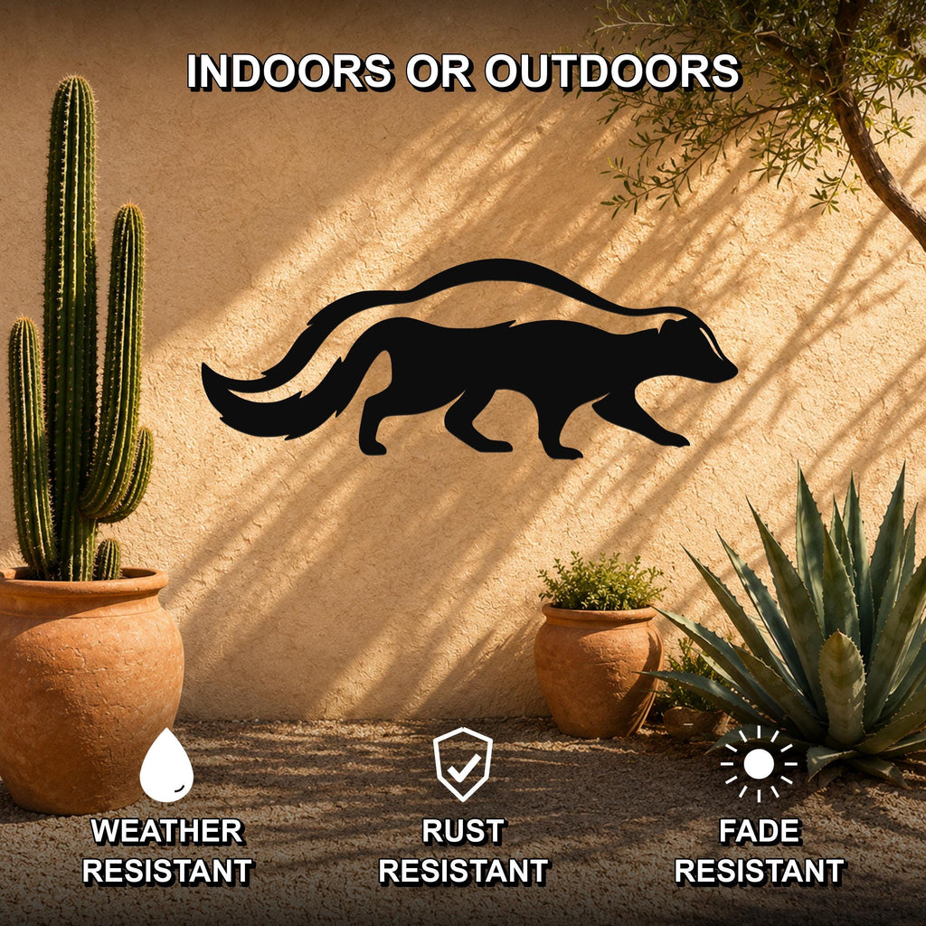 Black metal skunk silhouette wall art mounted on a stucco outdoor wall, surrounded by potted cacti and succulents in a sunny patio setting.
