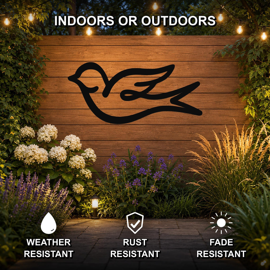 Black metal swallow bird silhouette wall art mounted on a wooden outdoor wall, surrounded by flowers and string lights, weather resistant, rust resistant, and fade resistant.