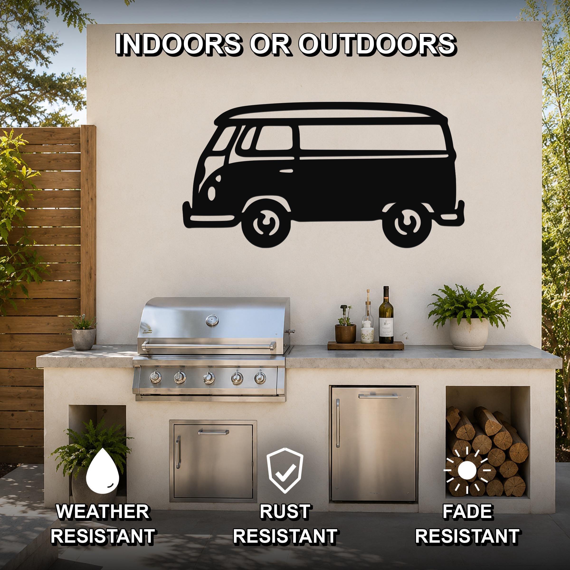 Black metal vintage van wall art silhouette mounted on an outdoor kitchen wall above a grill, with visible weather, rust, and fade resistance icons.