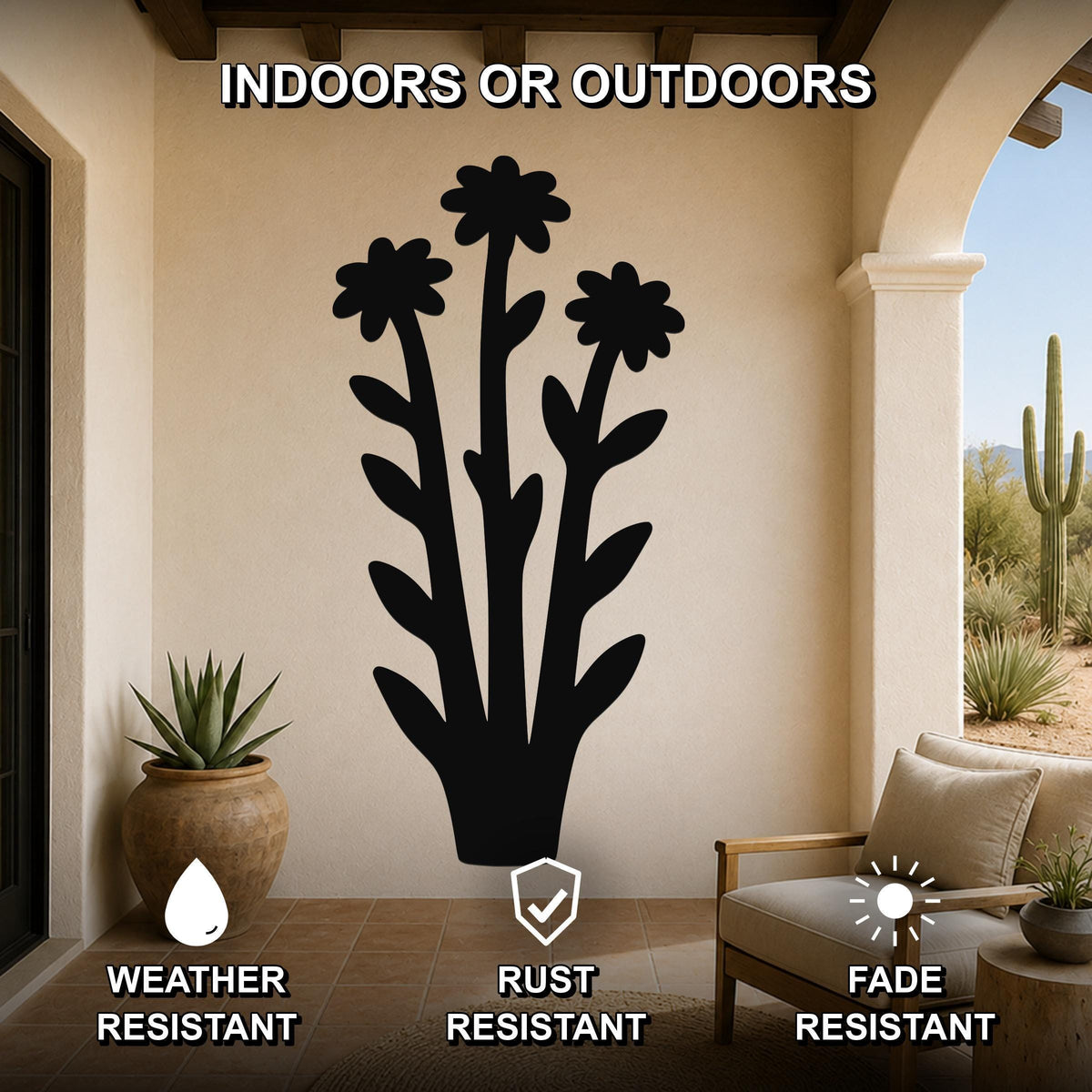Black metal wildflower wall art with three flower cutouts and leafy stems, mounted on a beige outdoor patio wall above a potted succulent and a wooden chair.