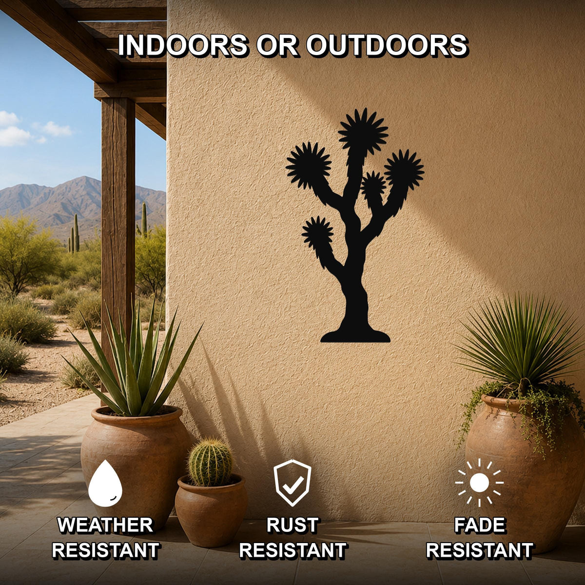 Black metal Joshua tree wall art silhouette mounted on an outdoor patio wall, with potted plants nearby and text indicating it is weather, rust, and fade resistant.