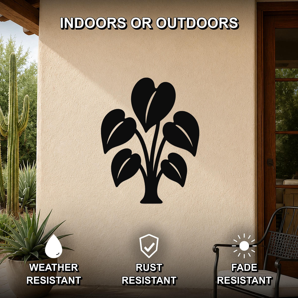 Black metal wall art of an elephant ear plant silhouette, mounted on an outdoor patio wall with weather, rust, and fade resistance noted.