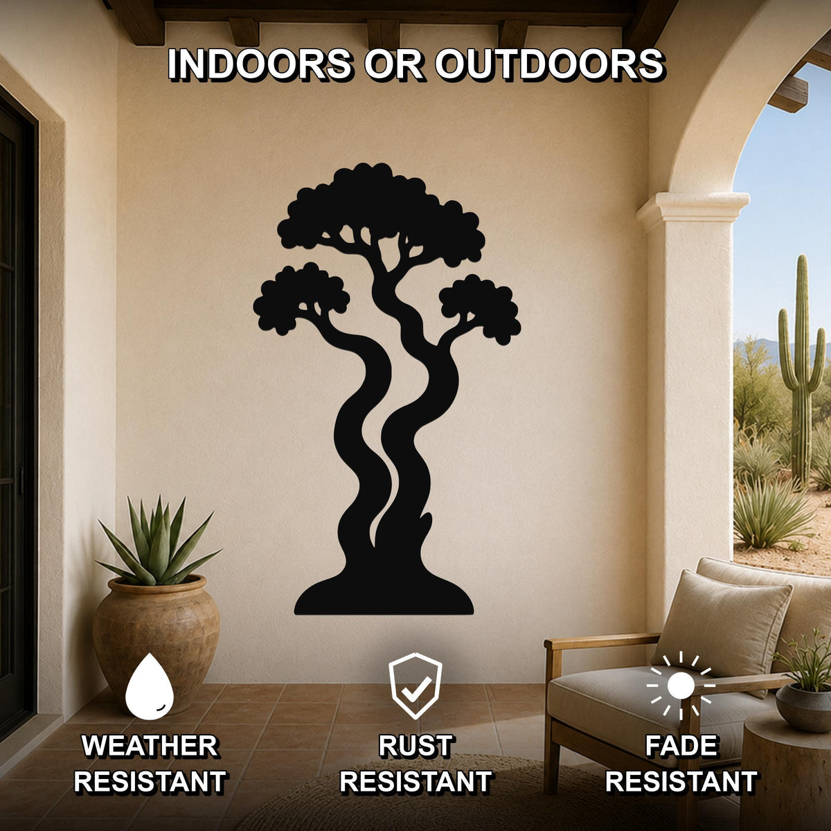 Black metal wall art silhouette of a bonsai tree with curved trunks and layered foliage, mounted on a beige outdoor patio wall above a potted succulent and a wooden chair.