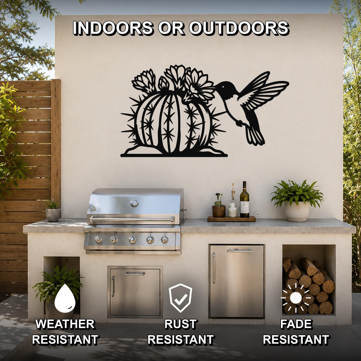 Black metal wall art featuring a hummingbird and flowering barrel cactus cutout, mounted on an outdoor kitchen wall above a counter.