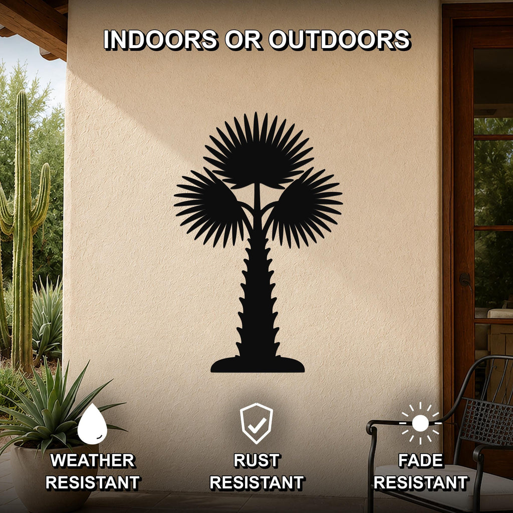 Black metal palm tree wall art with fan-shaped fronds and a textured trunk, mounted on an outdoor patio wall above a potted succulent.