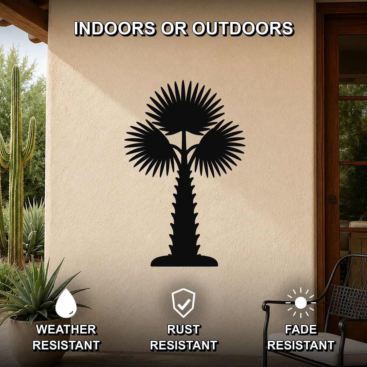 Black metal palm tree wall art with fan-shaped fronds and a textured trunk, mounted on an outdoor patio wall above a potted succulent.
