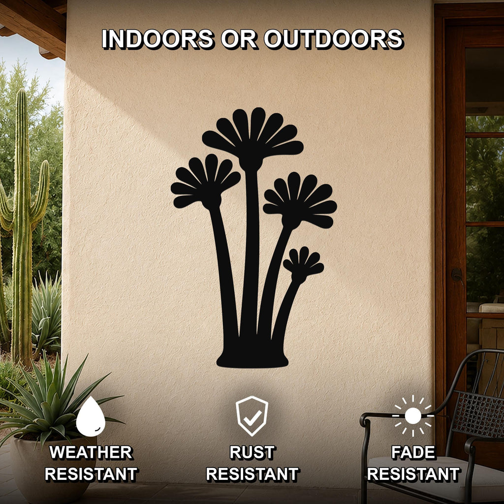 Black metal wall art featuring a fan palm tree silhouette with multiple fronds, mounted on an outdoor patio wall above a potted succulent.