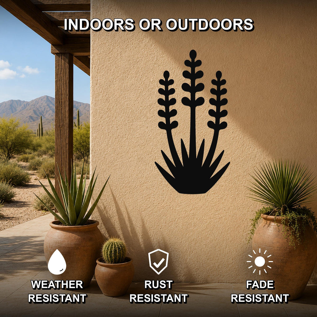 Black metal yucca wall art with layered leaf cutouts, mounted on an outdoor patio wall above potted plants, weather, rust, and fade resistant.