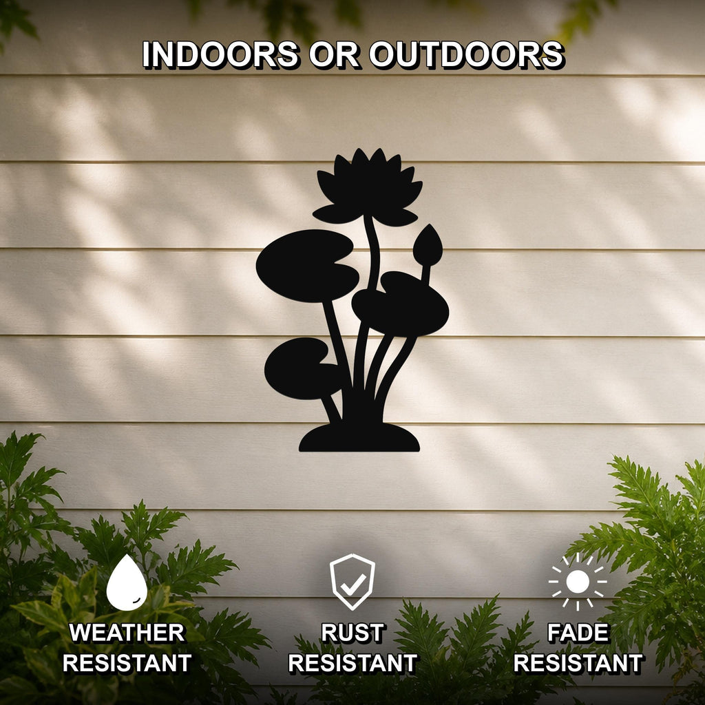 Black metal lotus water lily wall art silhouette with flower and leaf cutouts, mounted on a beige outdoor wall with greenery, weather, rust, and fade resistant.