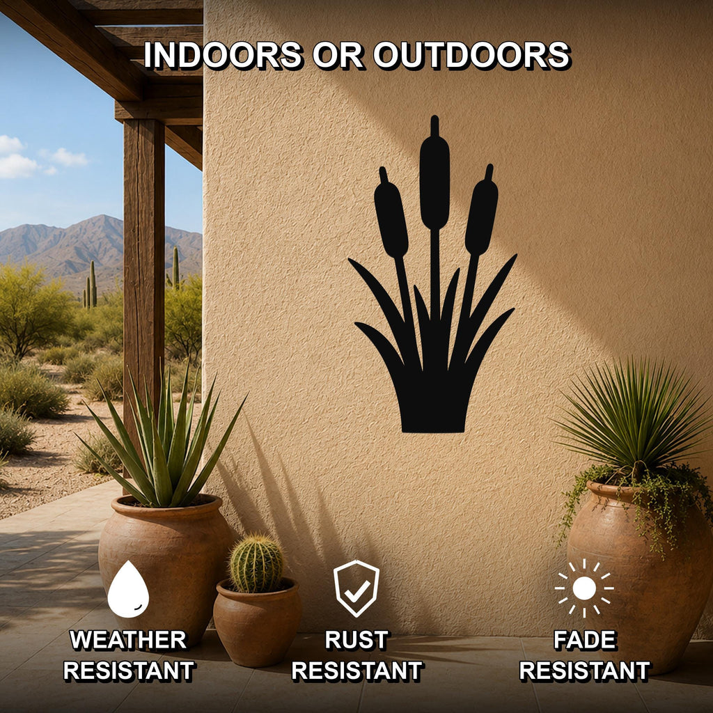 Black metal cattail wall art silhouette mounted on an outdoor patio wall, weather resistant, rust resistant, and fade resistant, displayed above potted plants.