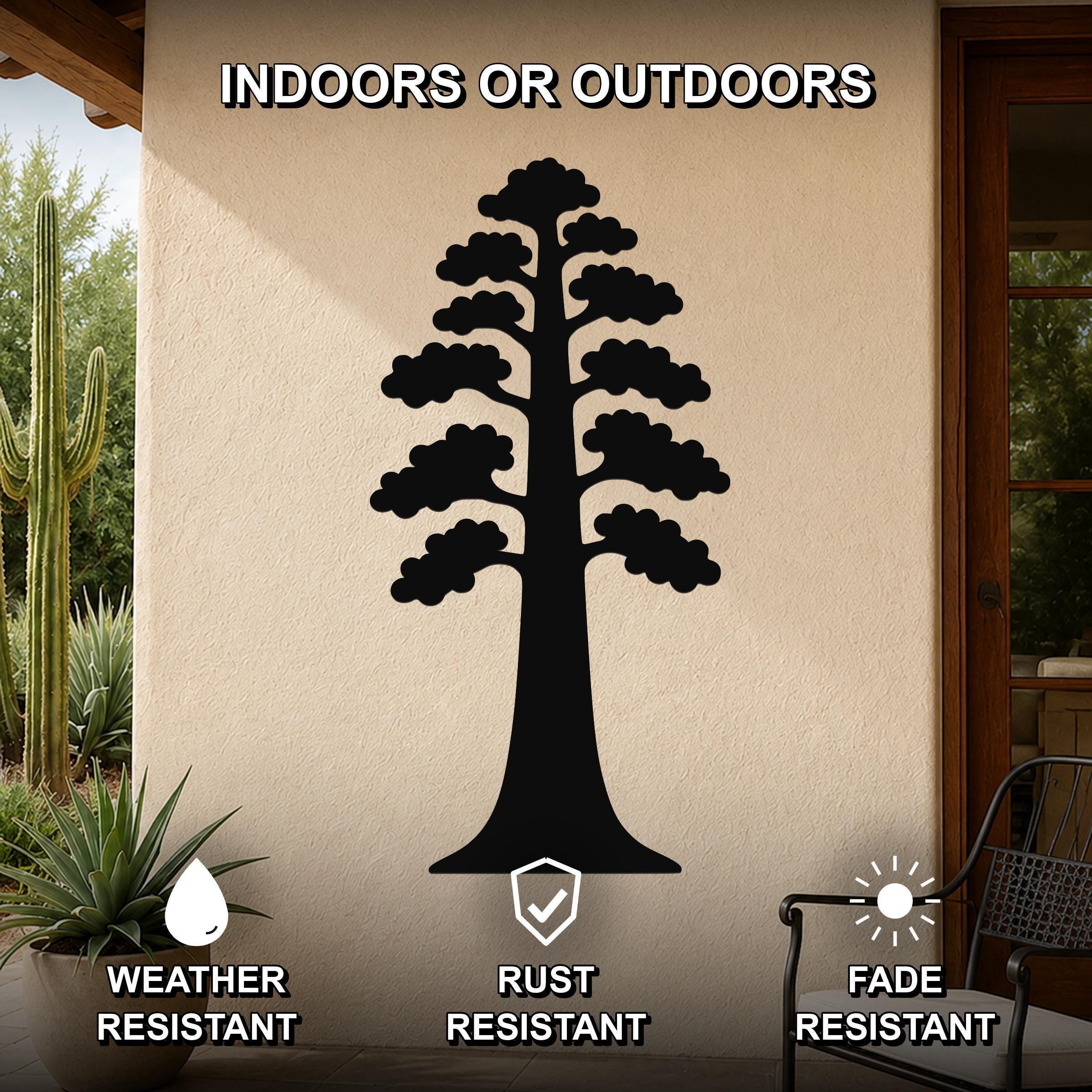 Black metal sequoia tree wall art with layered branch cutouts, mounted on an outdoor patio wall above a potted succulent.