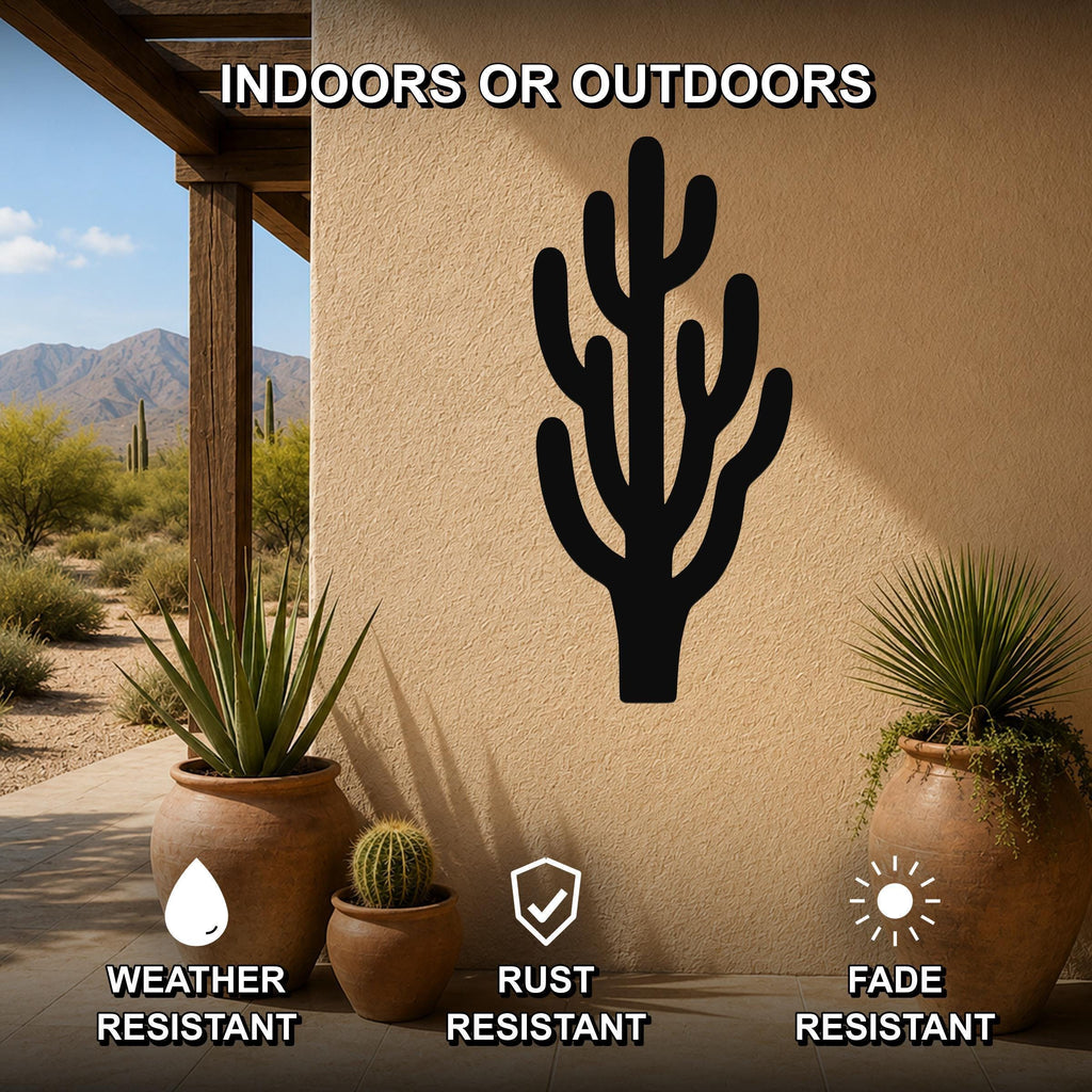Black metal saguaro cactus wall art with branching cutouts, mounted on an outdoor patio wall above potted plants.
