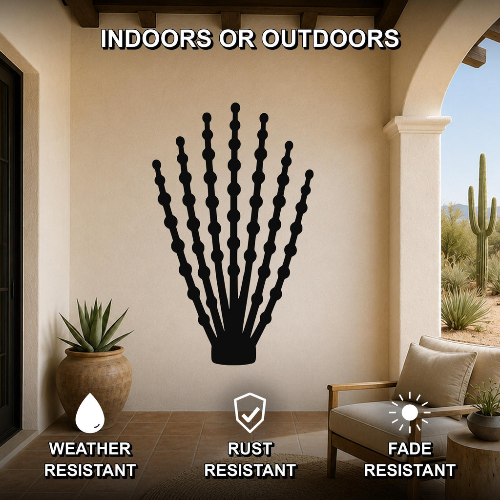 Black metal ocotillo wall art with beaded branch cutouts, mounted on a beige patio wall above a chair, weather, rust, and fade resistant.