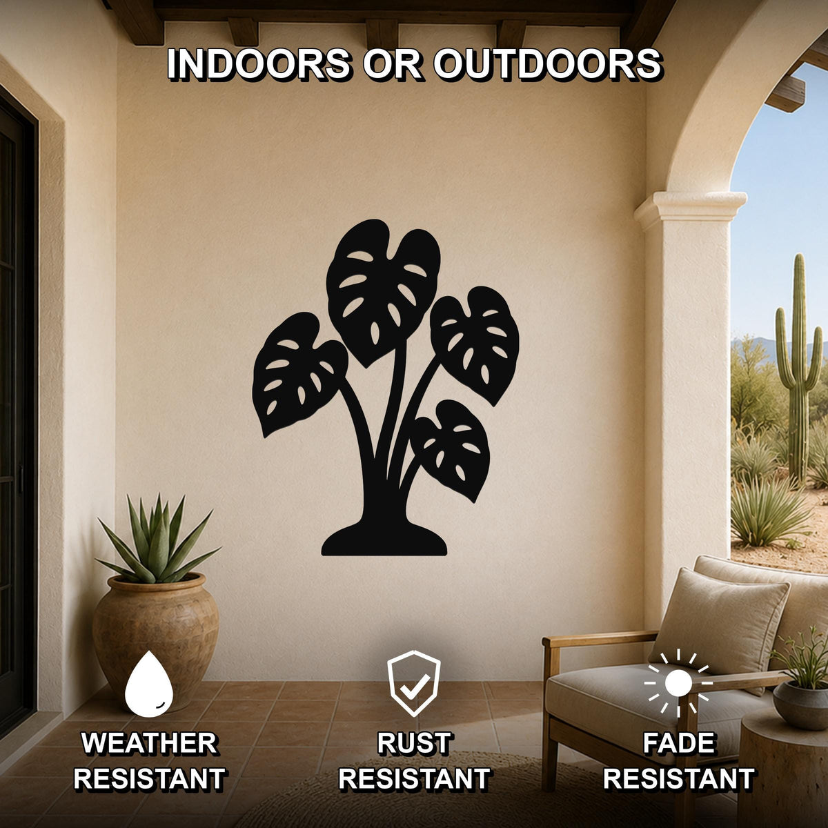 Black metal monstera plant wall art with leaf cutouts, mounted on a beige outdoor patio wall above a wooden chair.