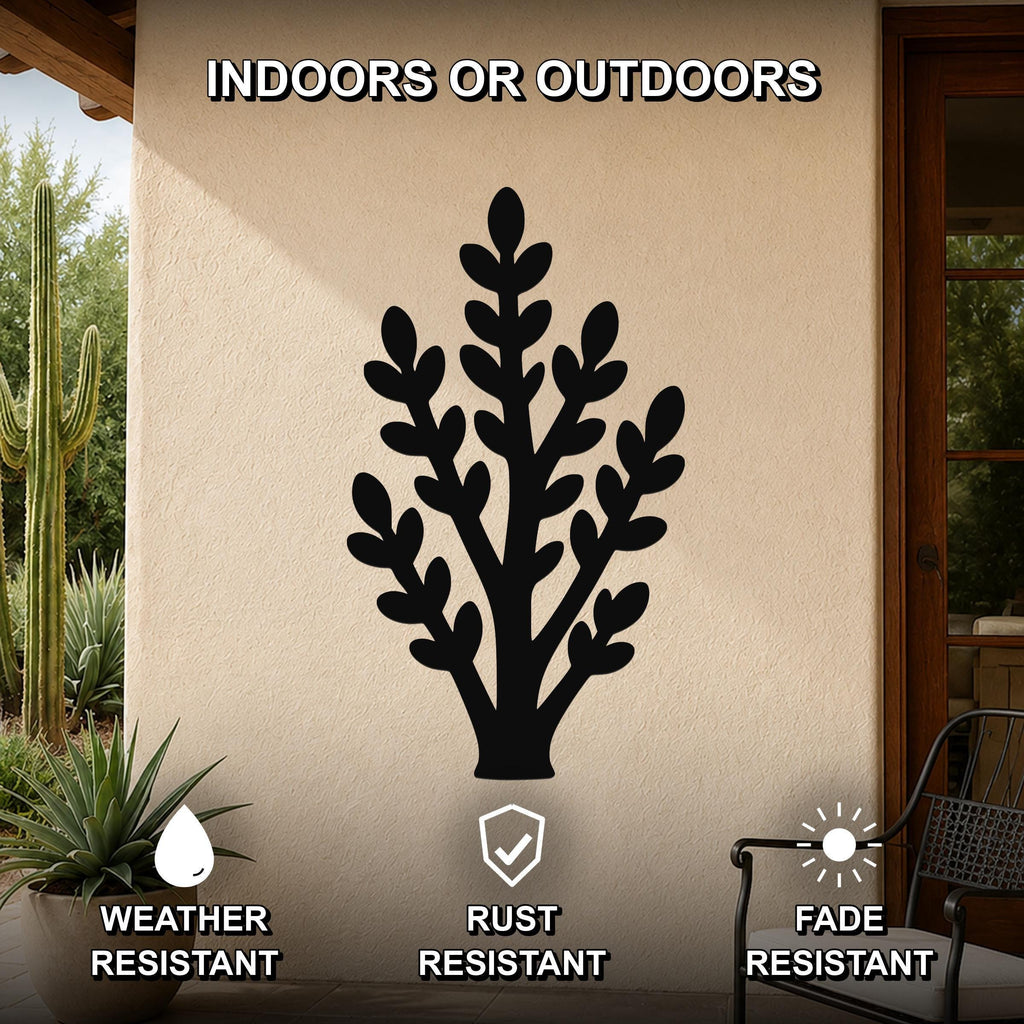 Black metal jade plant wall art with leafy branch cutouts, mounted on an outdoor patio wall above a potted succulent.