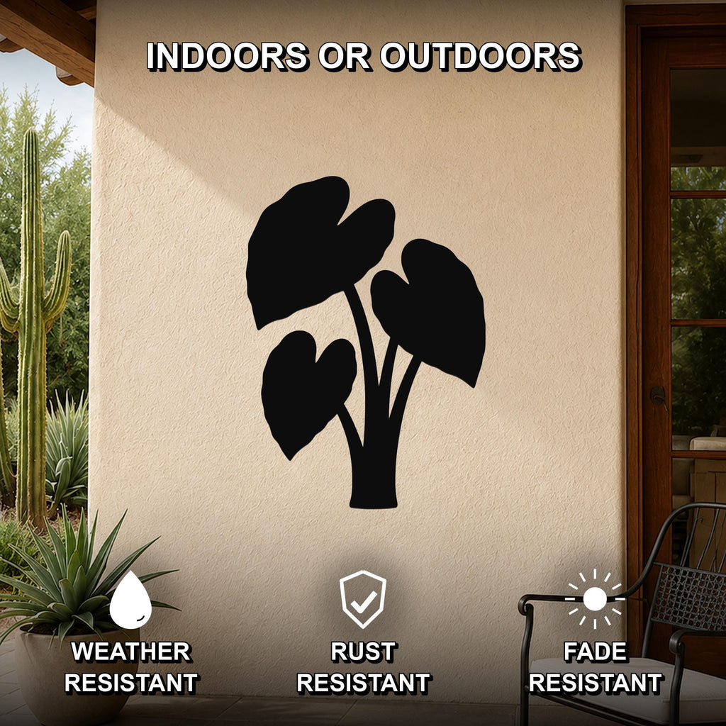 Black metal elephant ear plant wall art silhouette mounted on an outdoor patio wall, weather resistant, rust resistant, and fade resistant.