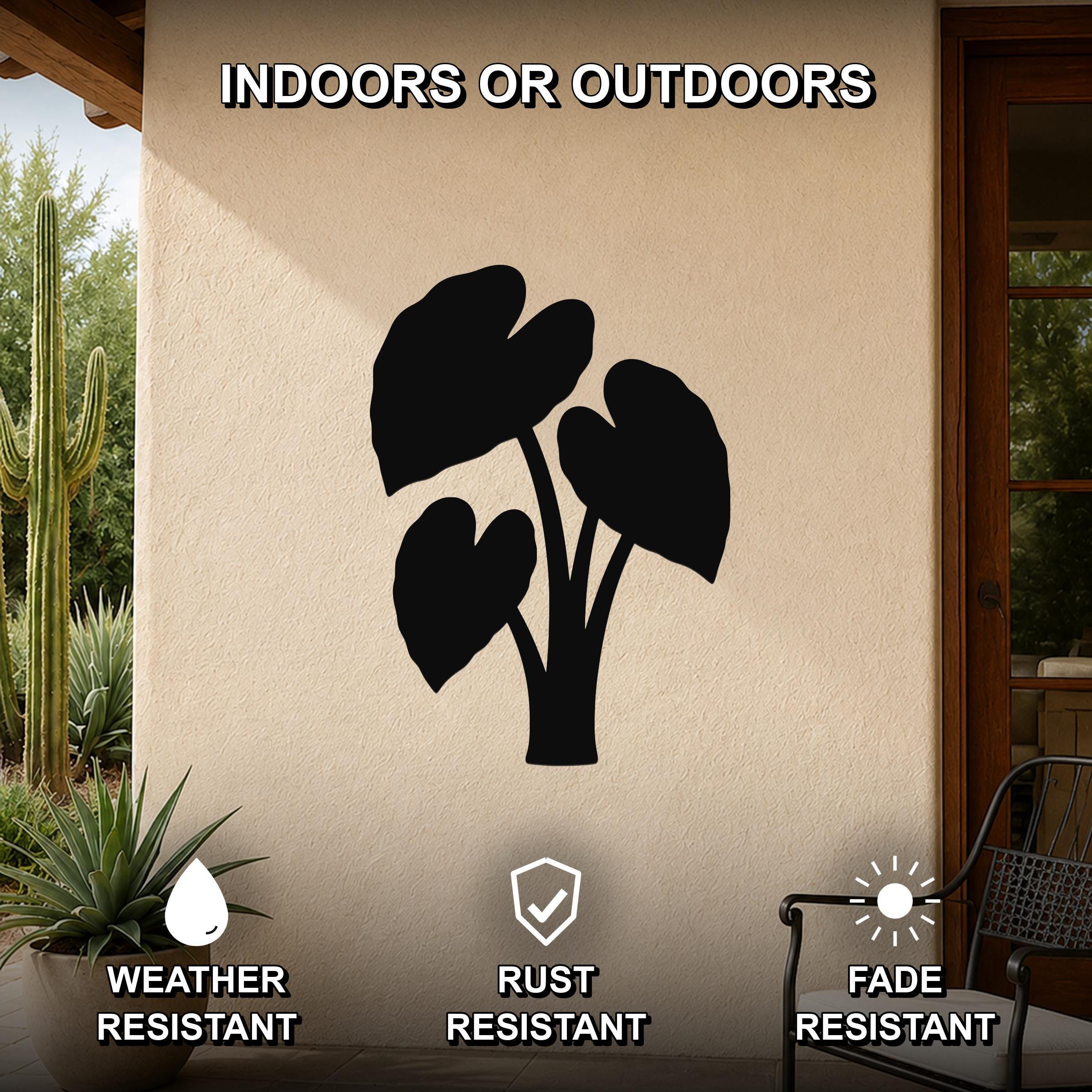 Black metal elephant ear plant wall art silhouette mounted on an outdoor patio wall, weather resistant, rust resistant, and fade resistant.