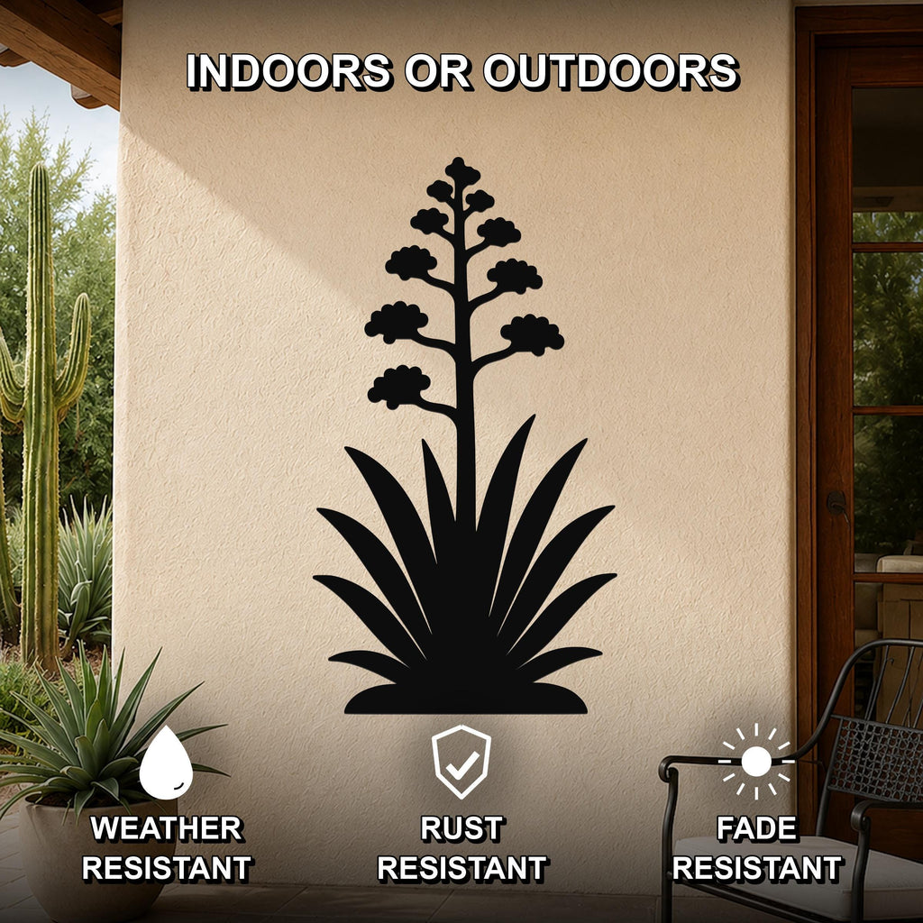 Black metal agave wall art with blooming flower cutout, mounted on an outdoor patio wall above a potted plant.