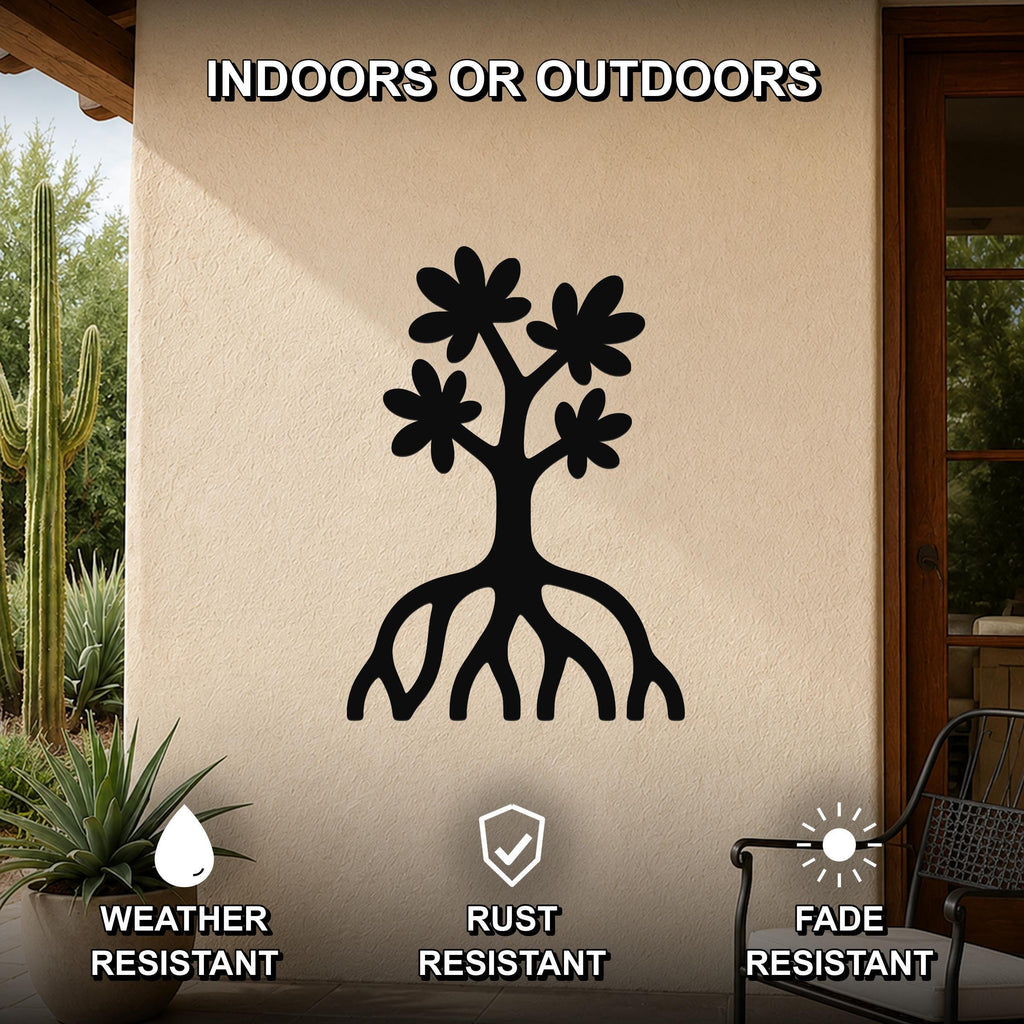 Black metal wall art featuring a tree silhouette with flower cutouts and visible roots, mounted on an outdoor patio wall.